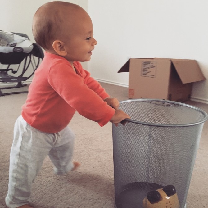 Charlie had zero problems living in an empty house; more room for pushing around his beloved trashcan!